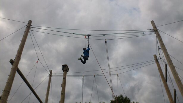 Picture of a student on a high wire